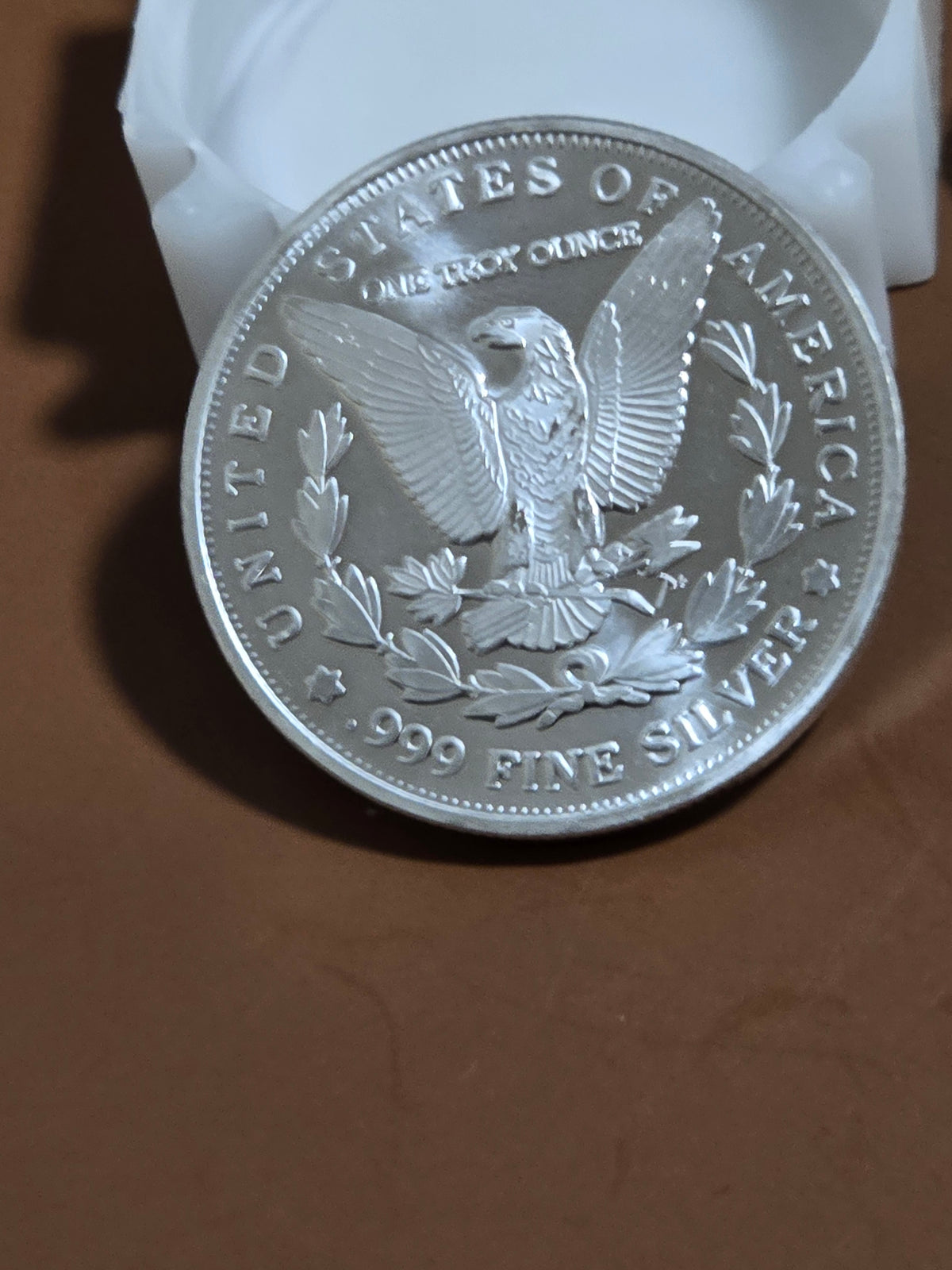 1oz silver Morgan round without capsule