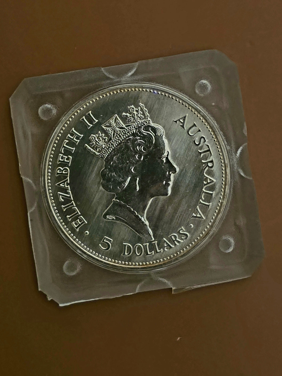 1oz 1990 silver Kookaburra (edges toned)